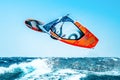 Windsurfer jumping in the waves Royalty Free Stock Photo