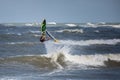Windsurfer Jumps out of the Water: Stunting on Waves