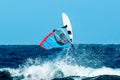 Windsurfer jumps over the wave
