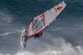 Windsurfer and large wave, Maui, Hawaii Royalty Free Stock Photo