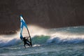 Windsurfer moving into a breaking wave. Royalty Free Stock Photo