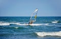 Windsurfer moving on the waves Royalty Free Stock Photo