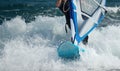 Windsurfer moving on the waves Royalty Free Stock Photo