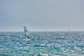 Windsurfer pro-rider surfing at high speed on Lake Garda, italy