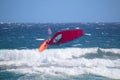 Windsurfer during a jump called backloop over the waves of the Atlantic Ocean, Tenerife, Spain Royalty Free Stock Photo
