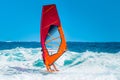Windsurfer riding the waves during a sunny summer afternoon Royalty Free Stock Photo