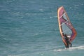 Windsurfer sailing in the sea.