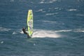 Windsurfer sailing in the sea.