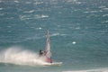 Windsurfer sailing in the sea.