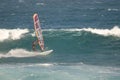 Windsurfer sailing in the sea.