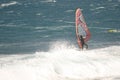 Windsurfer sailing in the sea.