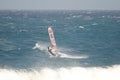 Windsurfer sailing in the sea.