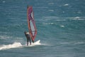 Windsurfer sailing in the sea.