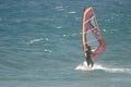 Windsurfer sailing in the sea.