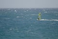 Windsurfer sailing in the sea.