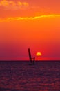 Windsurfer silhouette against sun Royalty Free Stock Photo