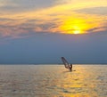 Windsurfer silhouette over sea sunset Royalty Free Stock Photo