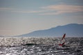 Windsurfer silhouette in Thracian sea at winter