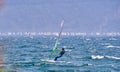 Windsurfer Surfing The Wind On Waves In Garda Lake, Recreational Water Sports, Extreme Sport Action. Recreational Sporting