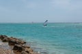 windsurfer young man on a windsurf on sea water Royalty Free Stock Photo