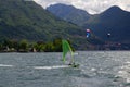 windsurfers on Lake Como with mountains