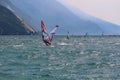 Windsurfers at Lake Garda glistening in the sun, Torbole, Italy