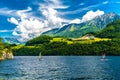 Windsurfers in the lake with mountains, Alpnachstadt, Alpnach Obwalden Switzerland