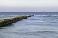 Windsurfers riding waves on a bright cold day Royalty Free Stock Photo