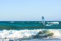 Windsurfers in the sea on Crete on sunset. Windsurfing in Heraklion. Greece