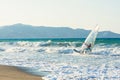 Windsurfers in the sea on Crete on sunset. Windsurfing in Heraklion. Greece