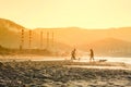 Windsurfers in the sea on Crete on sunset. Windsurfing in Heraklion. Greece