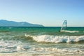 Windsurfers in the sea on Crete on sunset. Windsurfing in Heraklion