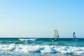 Windsurfers in the sea on Crete on sunset. Windsurfing in Heraklion