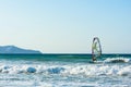 Windsurfers in the sea on Crete on sunset. Windsurfing in Heraklion