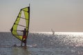 Windsurfers in the sea during sunset, active lifestyle