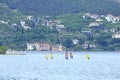 Windsurfers surfing the wind on waves In Garda Lake in Riva, Italy, Europe