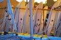 Windsurfing boards storage on a beach watersports facility in early morning