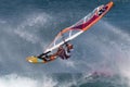 Windsurfer and large wave, Maui, Hawaii Royalty Free Stock Photo