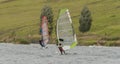 Windsurfing on Milada lake in wind day Royalty Free Stock Photo