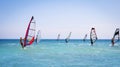 Windsurfing sails on the blue sea