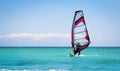 Windsurfing sails on the blue sea