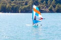 Windsurfing. A water sportsman on a sailboard