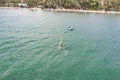 windsurfing, wind surf. Extreme sport in tropical blue ocean, clear water. Aerial views, top view of windsurfing on the waves of Royalty Free Stock Photo