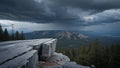 Windswept granite outcrop above dark pine forest with storm clouds looming Royalty Free Stock Photo
