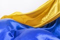 Windswept shiny satin fabrics in the colors of the flag of Ukraine