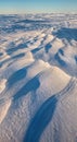 Windswept Snow Formations Sastrugi with Sculptural Ridge Patterns and Strong Side Lighting Royalty Free Stock Photo