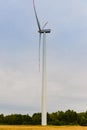 Windturbine. Eco power renewable energy production from wind. Windmill saves the earth`s natural ingredients. Green ecology and Royalty Free Stock Photo