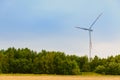 Eco power renewable energy production from wind. Windmill saves the earth& x27;s natural ingredients. Green ecology and Royalty Free Stock Photo