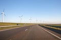 Windturbines along a countryroad Royalty Free Stock Photo