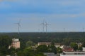 Windturbines on the horizon of a town